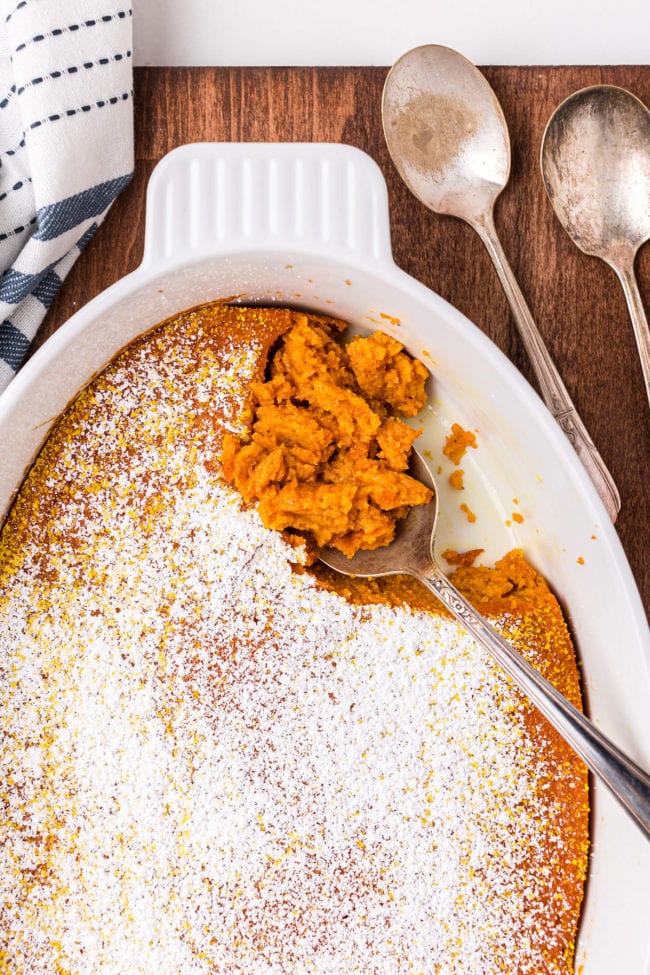 spoonful of carrot souffle in baking dish