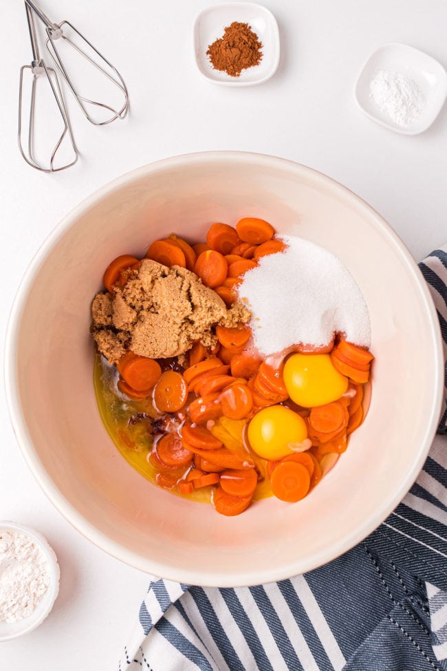 ingredients for carrot souffle in a mixing bowl