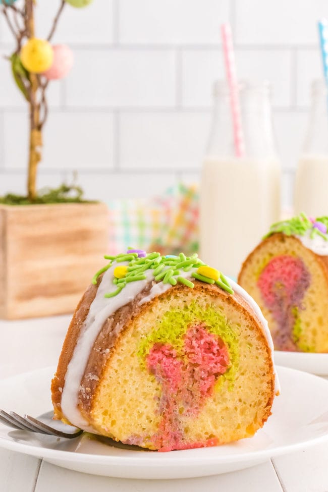 slice of bundt cake with Easter colors swirled inside