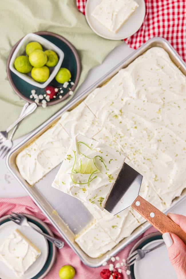 sheet pan cake with a serving on a spatula