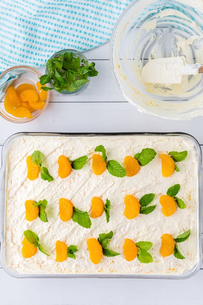 Mandarin Orange Cake with pineapple frosting in glass 9x13 dish