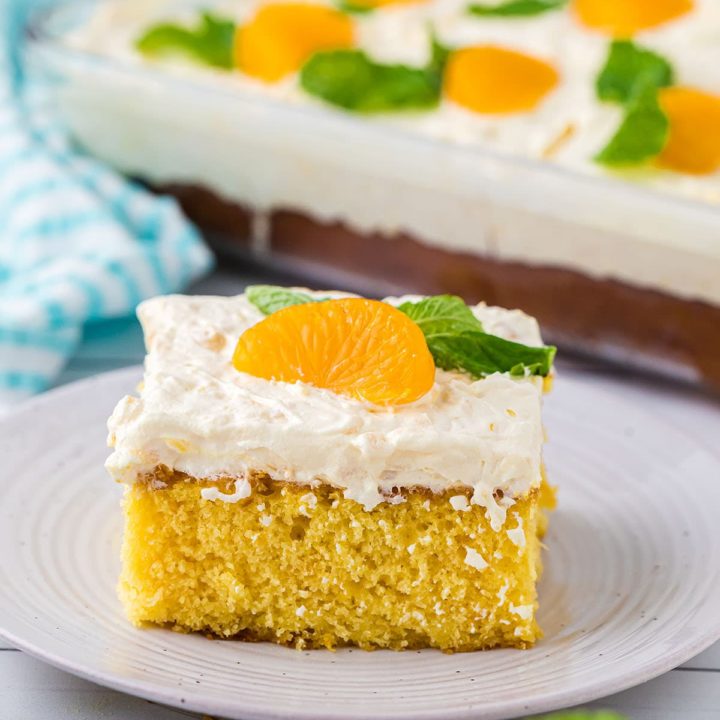 slice of cake on a plate and full cake in background