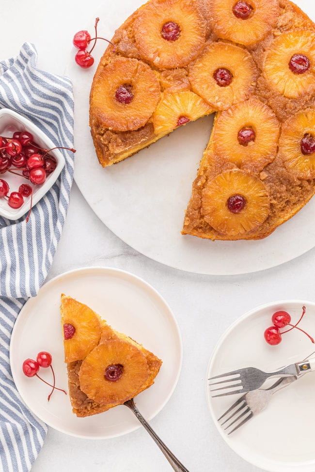 Pineapple Upside Down Cake with a piece cut and on a plate