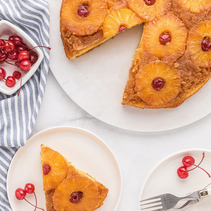 Pineapple Upside Down Cake with a piece cut and on a plate