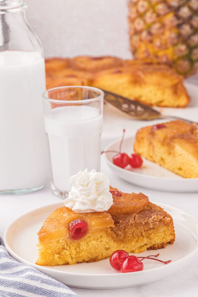a serving of Pineapple Upside Down Cake with a glass of milk