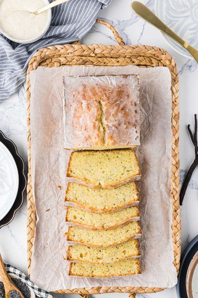 loaf of bread half cut on a basket