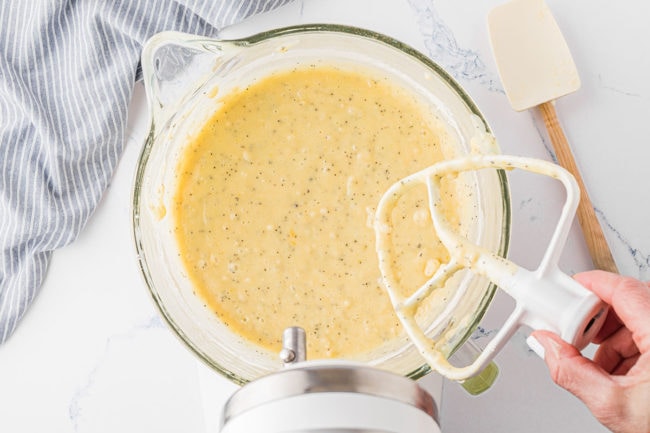 mixing up poppy seed bread in electric mixer