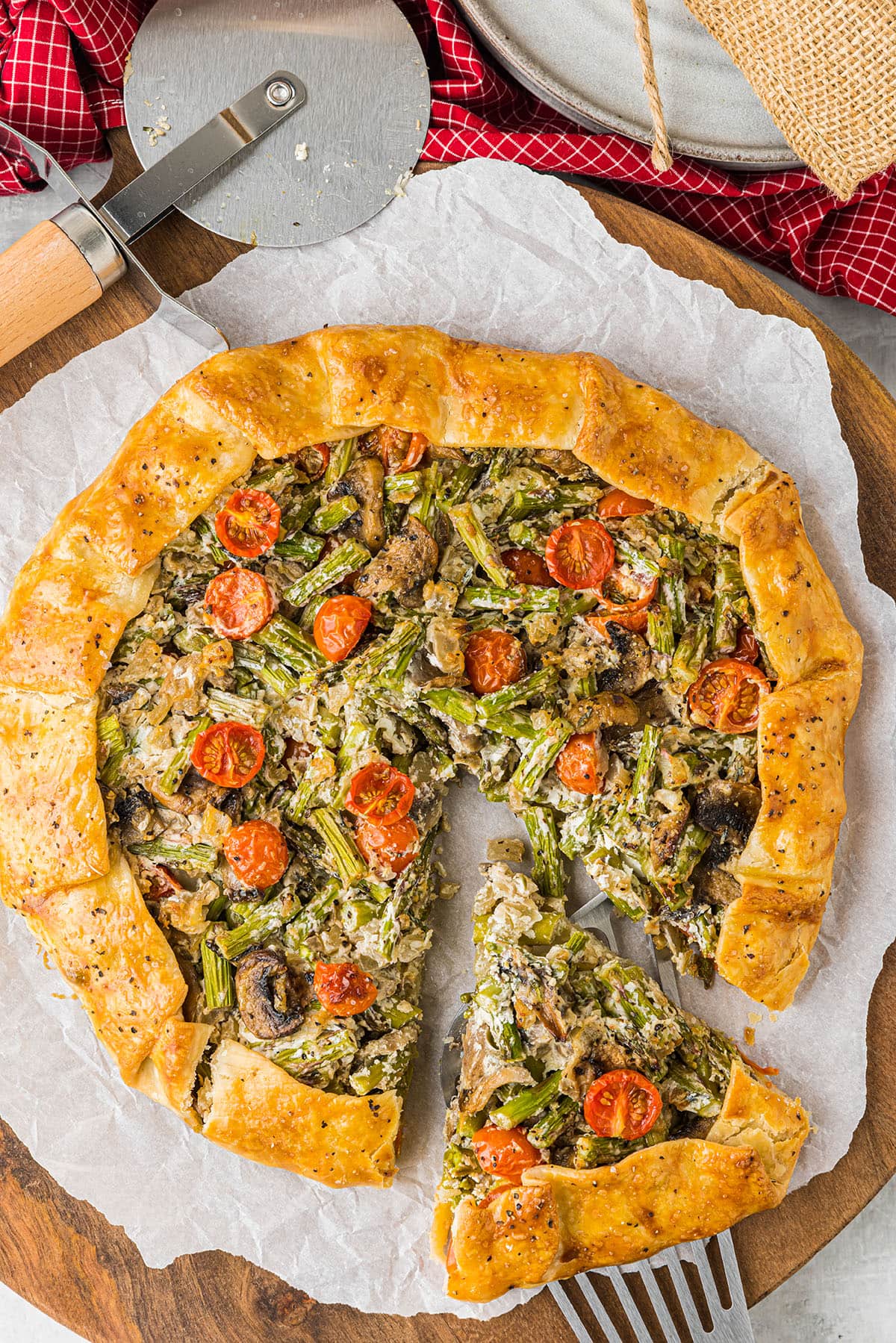 rustic veggie pie with one slice cut