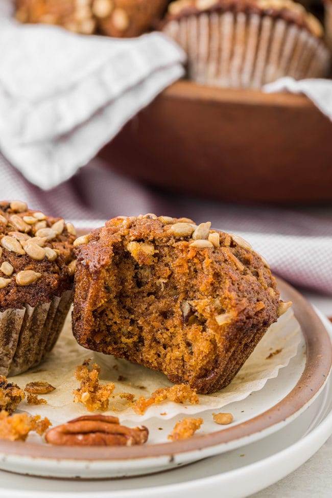 muffin on a plate with bite taken