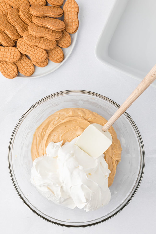 peanut butter fluff with cool whip in a glass bow step 3