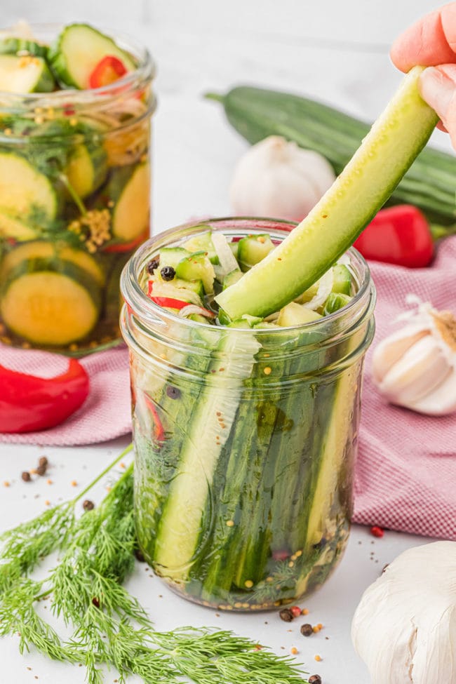 a canning jar with refrigerator pickle spears