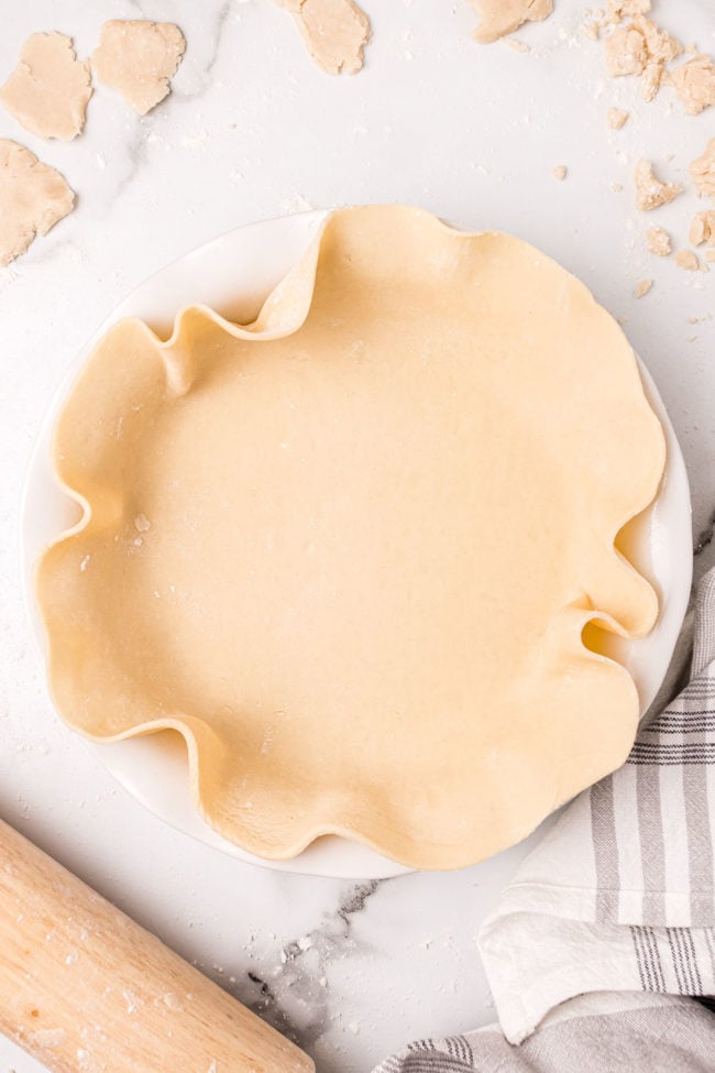 unbaked pie crust laied in a pie plate