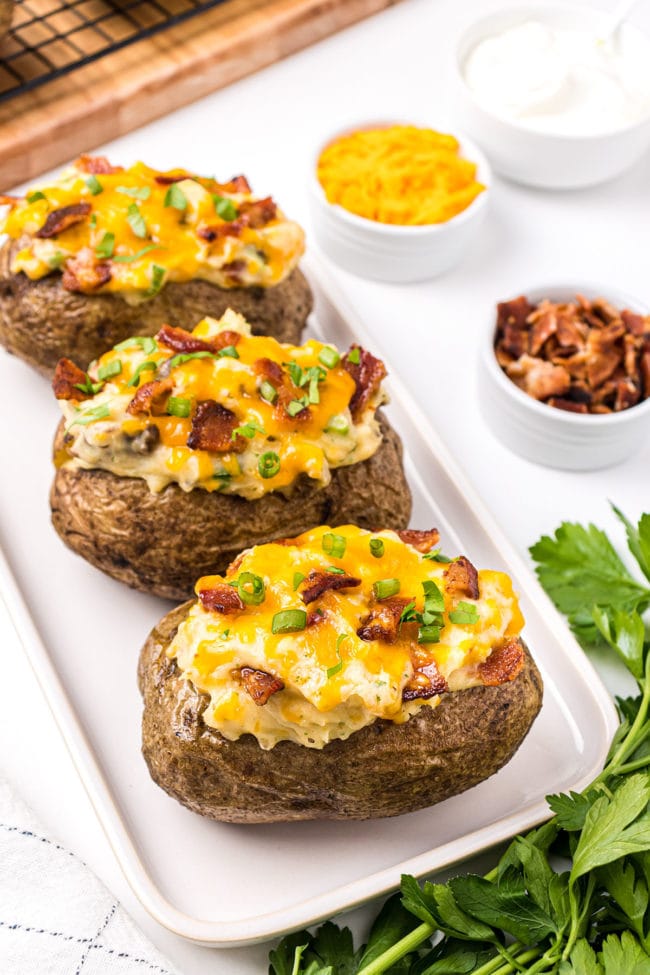tray of baked potato skins with cheese and bacon