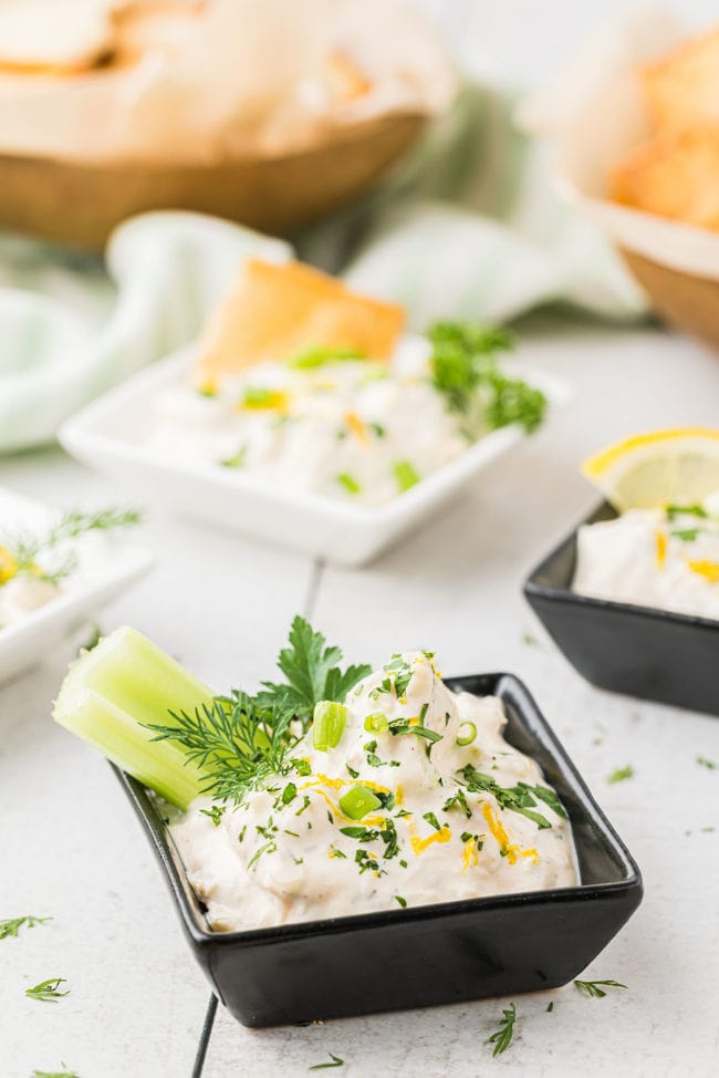 crab dip in black and white single serve square bowls