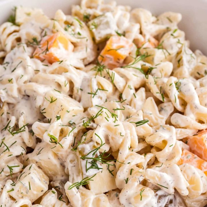 Pickle pasta salad in a white serving bowl