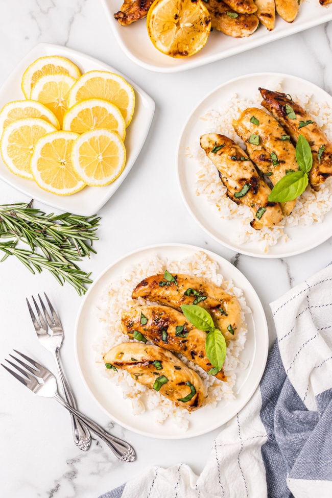 grilled lemon rosemary chicken tenders plated with white rice