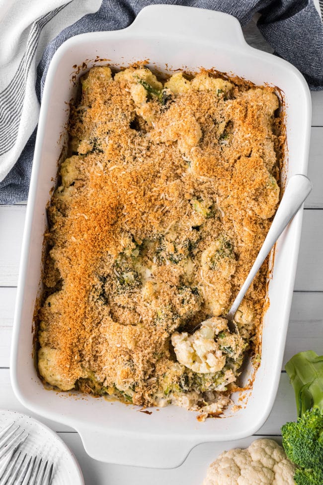 Cheesy Broccoli Cauliflower Casserole with serving spoon