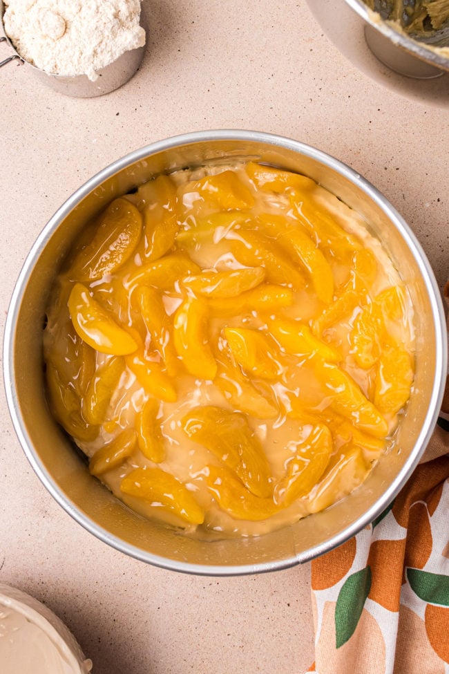 peach pie filling on top of coffee cake batter