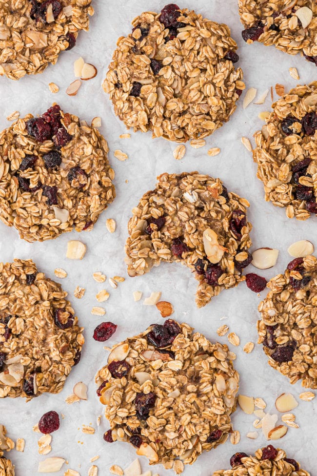 cookies laid out on a counter - one with a bite missing