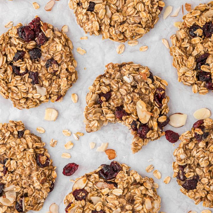 cookies laid out on a counter - one with a bite missing