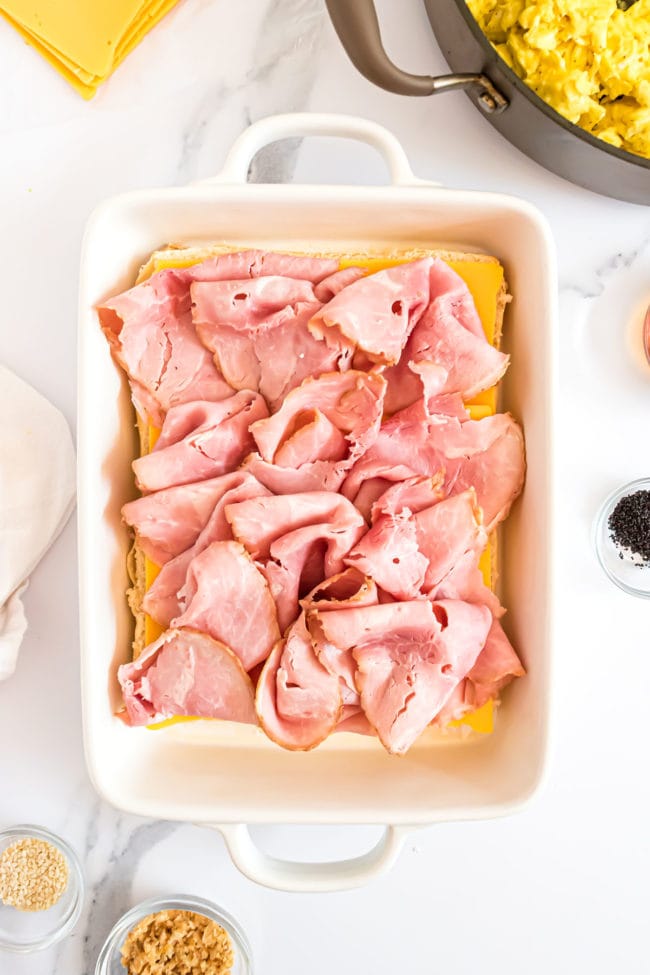 ham slices on buns in a casserole dish