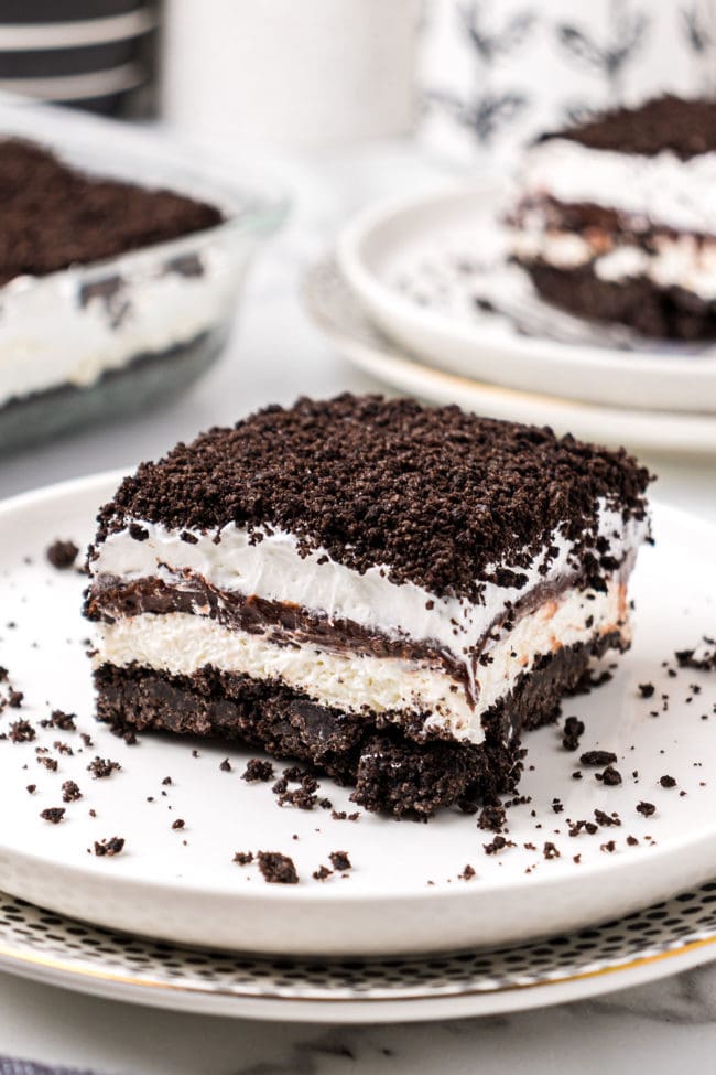 No-Bake Chocolate Lasagna with an Oreo cookie crust on a white plate