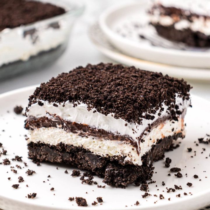 No-Bake Chocolate Lasagna with an Oreo cookie crust on a white plate