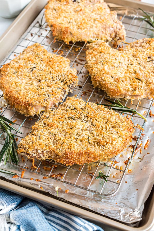 baked pork chops on a baking sheet