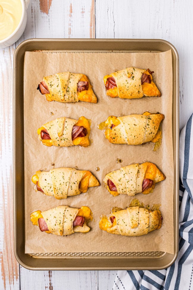 Oven-Baked Ham and Cheese Roll-Ups on a baking sheet