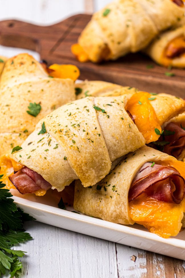 Crescent Roll Sandwiches with ham and cheese on a white tray