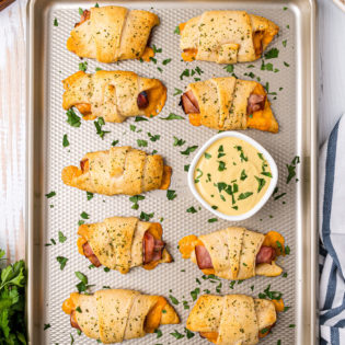 Baked Crescent Roll Sandwiches on a baking sheet