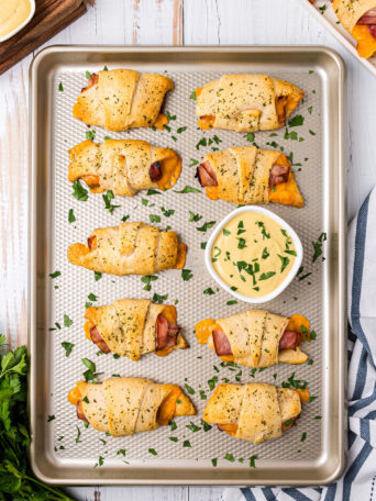 Baked Crescent Roll Sandwiches on a baking sheet