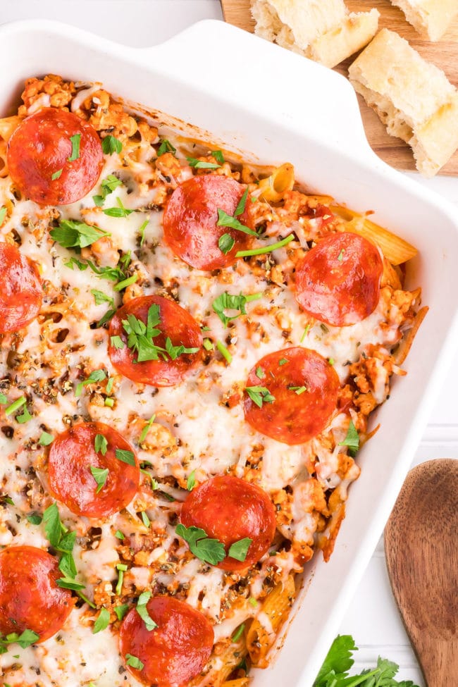 pizza pasta casserole in a white baking dish