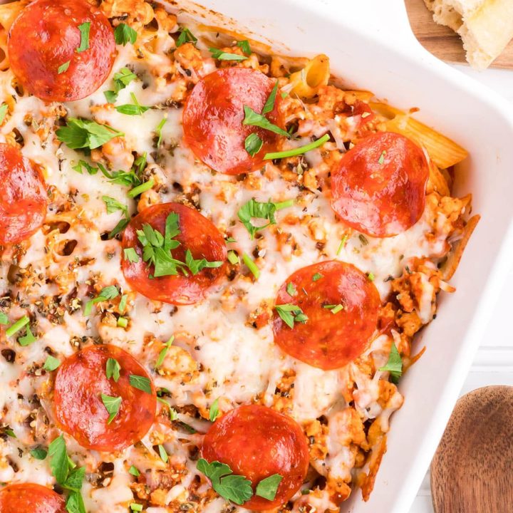 pizza pasta casserole in a white baking dish