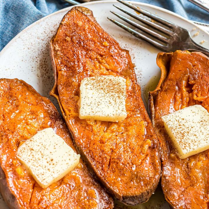 three quick baked sweet potatoes with a pat of butter and sprinkle of cinnamon