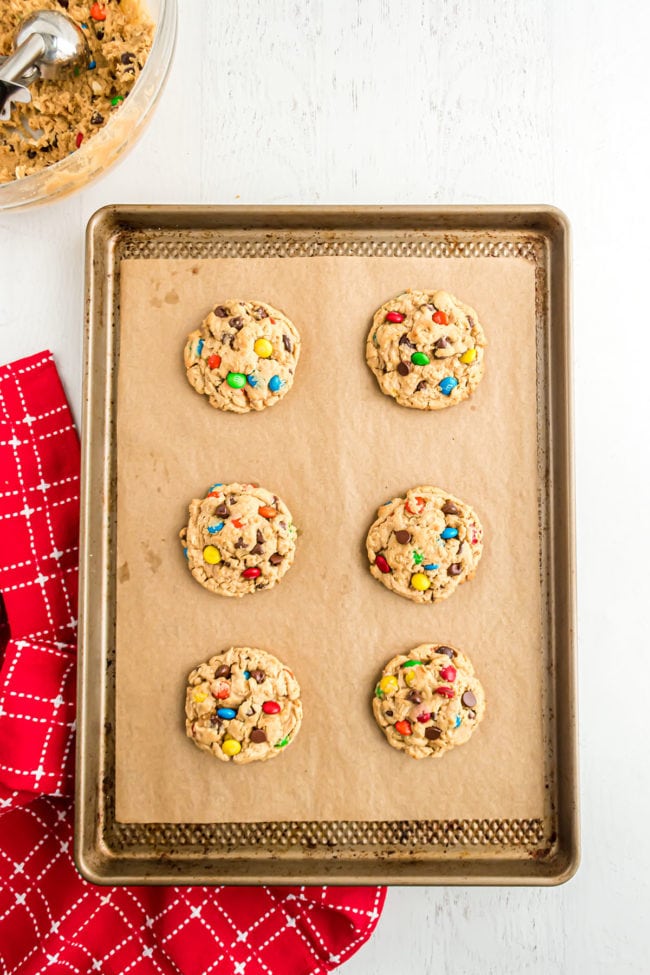 baked cookies on a sheet pan with parchment