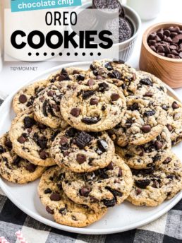 pile of Chocolate chip Oreo filled cookies on a white platter