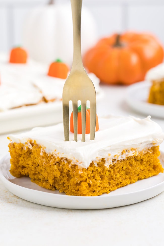 fork in a slice of pumpkin sheet cake