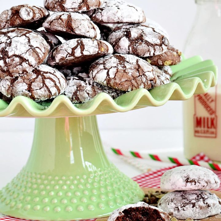 green cake stand stacked with crinkle cookies