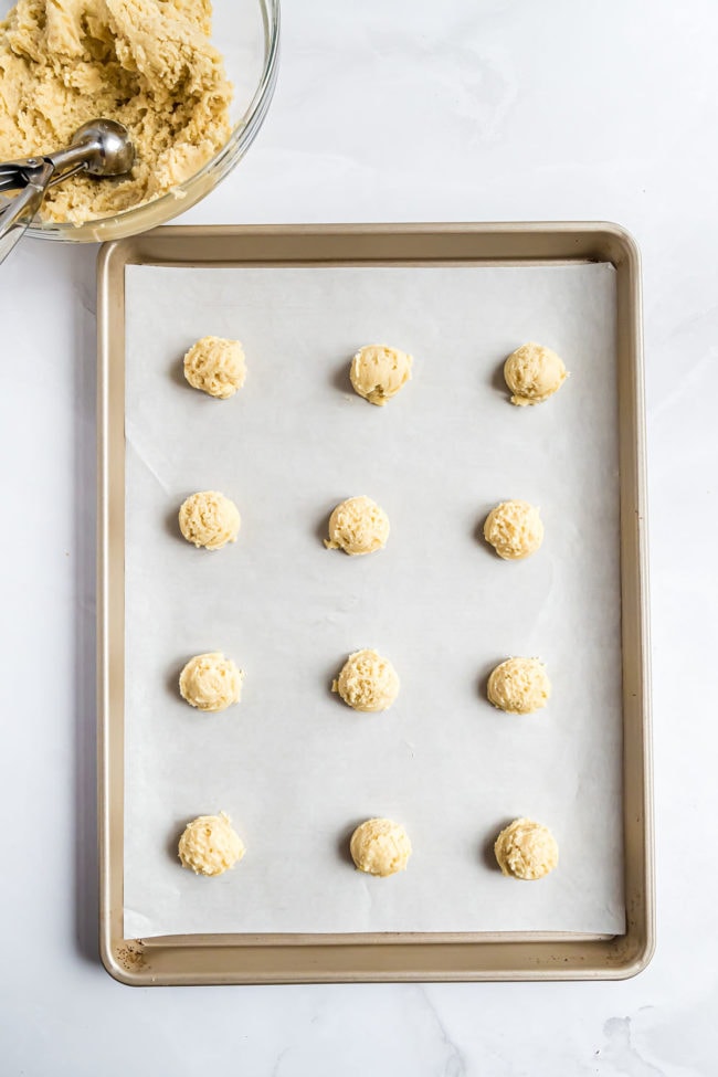 ricotta cookie dough balls on a sheet pan