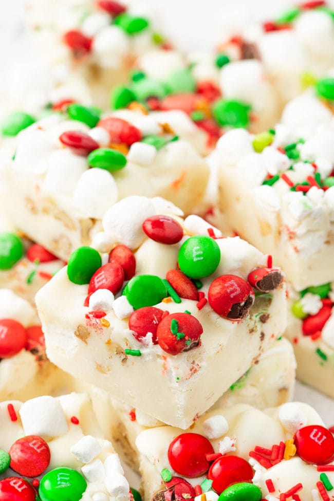white rocky road fudge with holiday candies and marshmallows