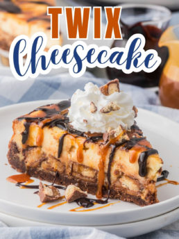 cheesecake with whipped cream and Twix candy bar chunks