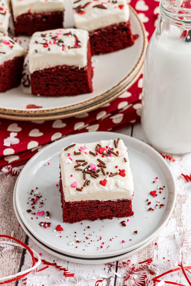 red velvet brownies with Valentine sprinkles on a white plate