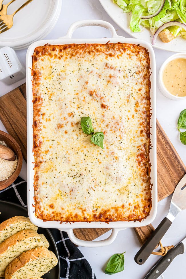 white baking dish filled with beef and ricotta lasagna