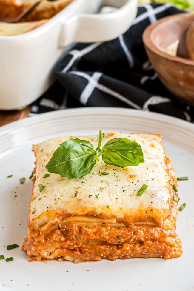 serving of lasagna on a white plate