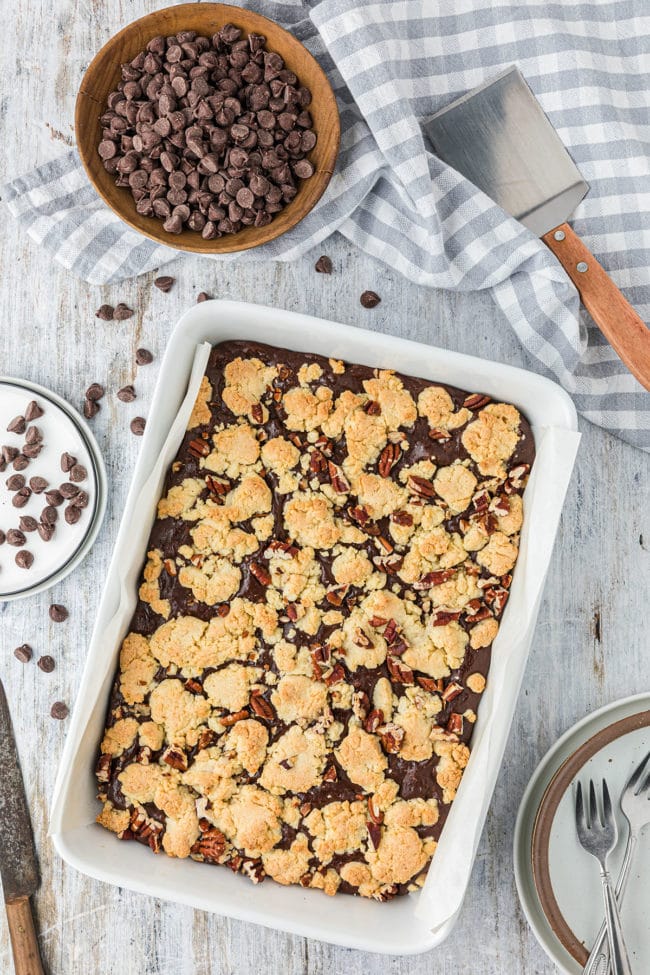 baked fudge nut cookie bars in a white baking dish