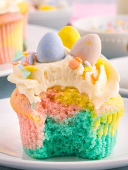A bite missing from a marble cupcake with Spring colors