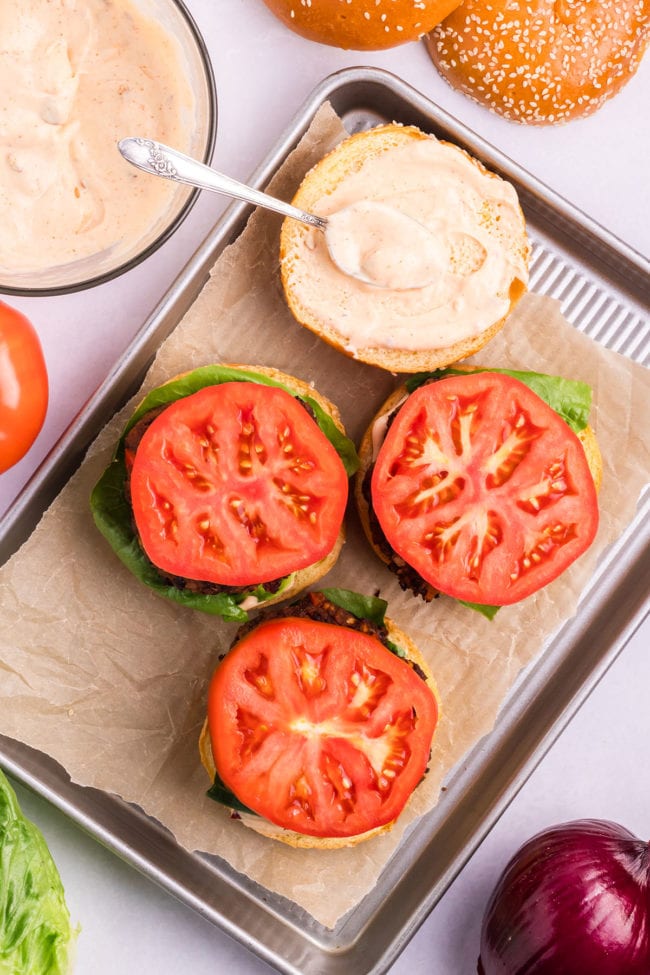 adding tomatoes and chipotle may to burgers