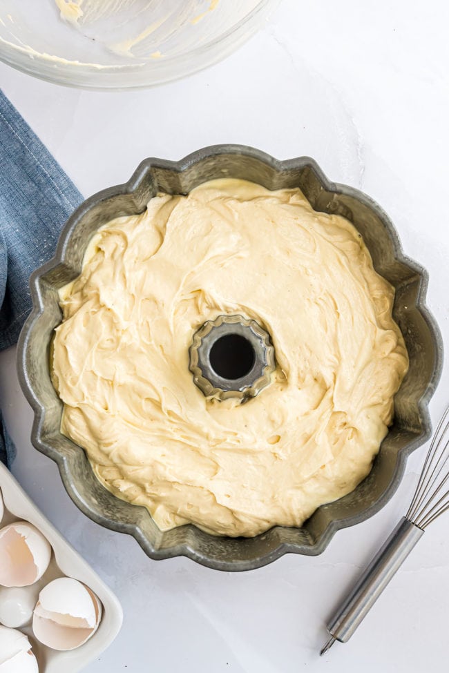 pound cake batter in a fluted tub pan