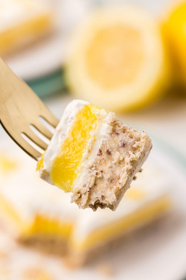 Bite of lemon lush dessert on a fork
